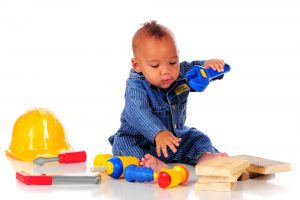 A photo of a baby playing with toys